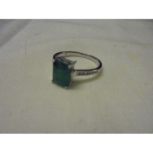 1005 - An 18ct white gold emerald and diamond ring, size L half, 2.9 grams.