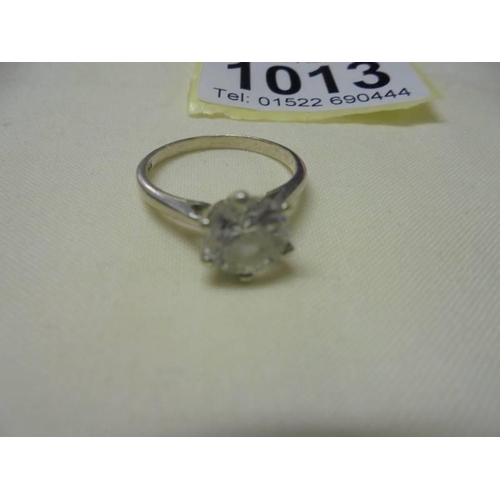 1013 - Two silver stone set rings, sizes N and O.