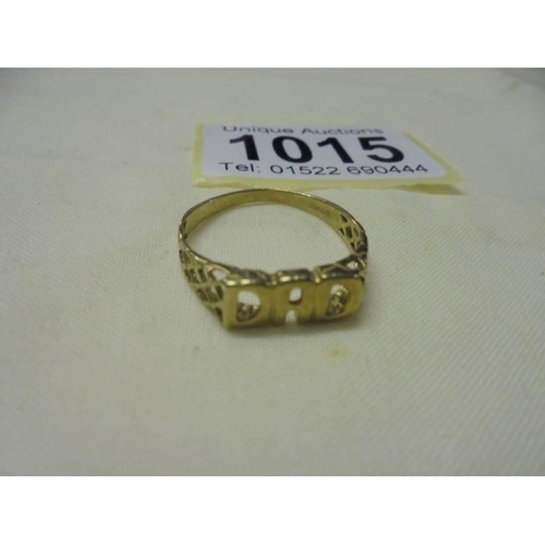 1015 - A 9ct gold 'Dad' ring size P and a 9ct gold stone set ring (missing two stones) size L, 4.6 grams.