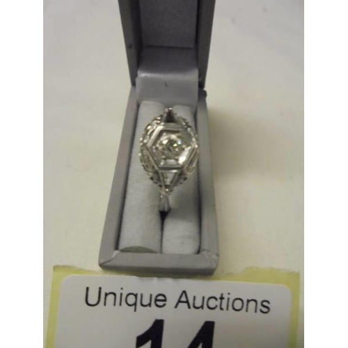 14 - An 18ct six sided diamond ring with central stone, good clarity, size M, 2.1 grams.