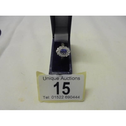 15 - An 18ct gold oval sapphire and diamond ring, size M half, 3.6 grams.