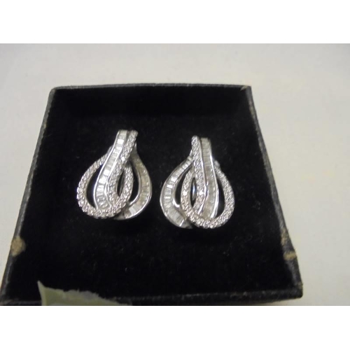 7 - A pair of white gold and diamond earrings, 7.8 grams.
