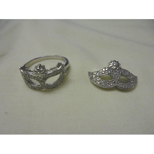 1024 - Two silver rings with matching pendants.