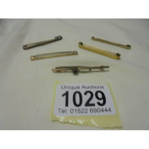 1029 - Five 9ct gold tie pins/bar brooches, 8 grams.