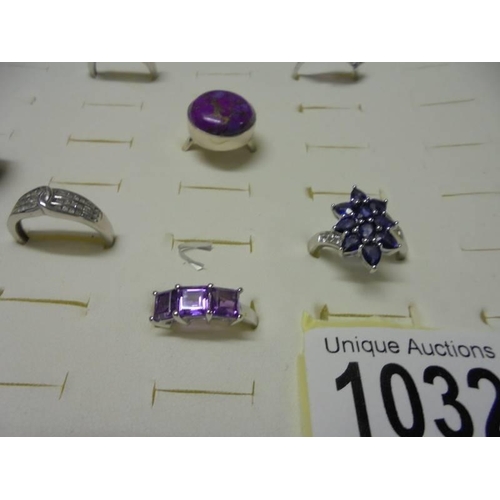 1032 - A good quality ring case with eight assorted silver rings.