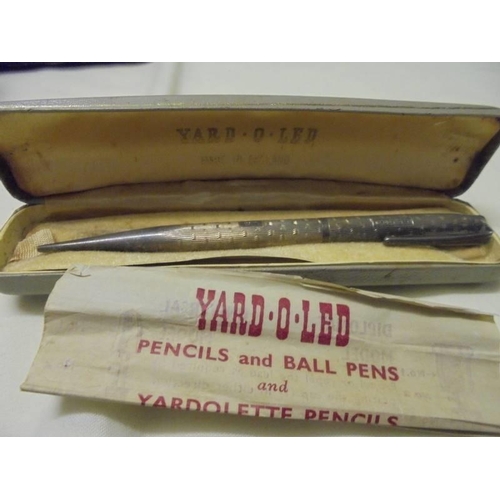 1035 - A silver 'Yard O' Lead' pencil, another silver pencil, a silver bookmark and two silver thimbles.