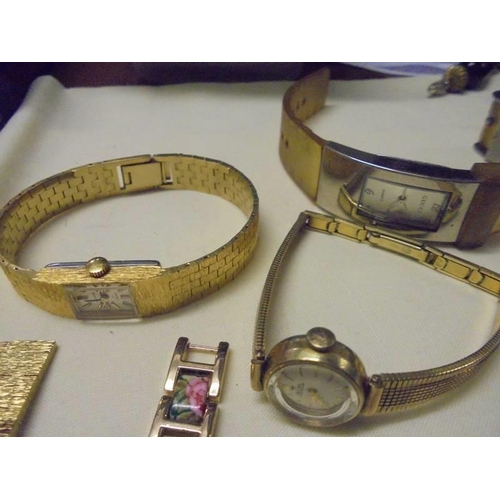 1038 - A mixed lot of ladies wristwatches including Gucci, Cocktail watches etc.,