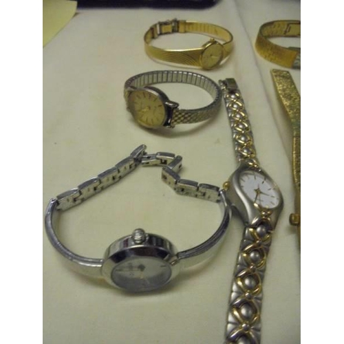 1038 - A mixed lot of ladies wristwatches including Gucci, Cocktail watches etc.,