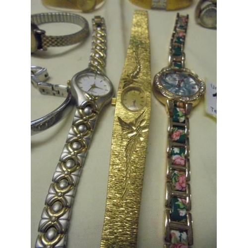 1038 - A mixed lot of ladies wristwatches including Gucci, Cocktail watches etc.,