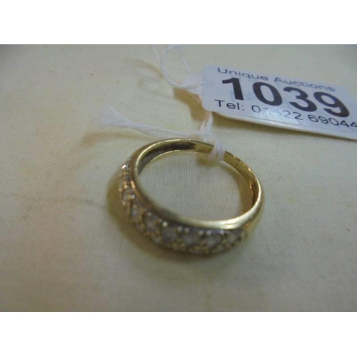 1039 - A yellow gold multi stone ring, size L, 2.1 grams.