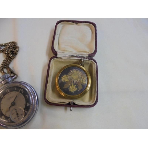 1044 - Three old pocket watches a/f, one on brass chain and a dried flower in case.