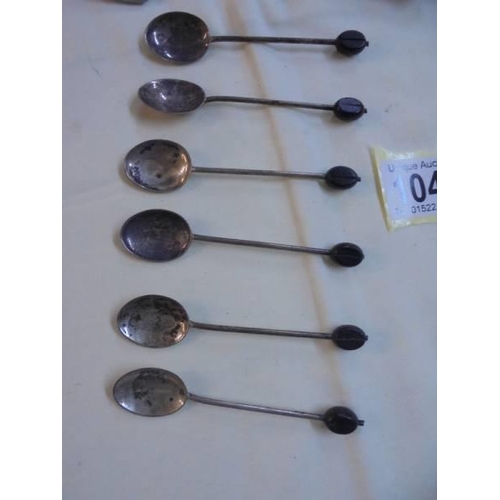 1045 - Six silver coffee bean spoons, a silver handled sugar spoon and an unmarked spoon.