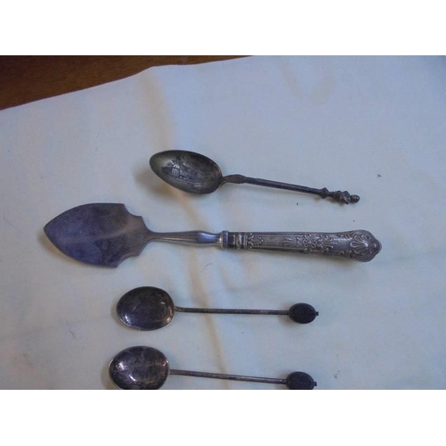 1045 - Six silver coffee bean spoons, a silver handled sugar spoon and an unmarked spoon.