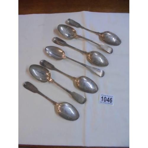 1046 - Seven silver dessert spoons.