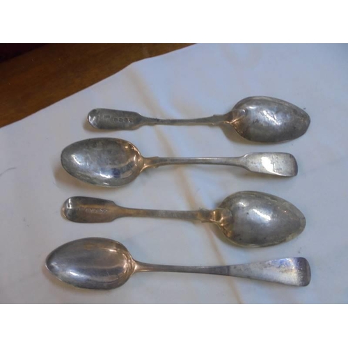 1046 - Seven silver dessert spoons.