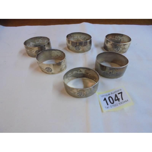 1047 - A set of six napkin rings monogrammed H S P and with middle eastern scenes on reverse (possibly silv... 