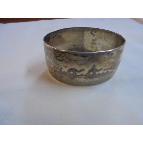 1047 - A set of six napkin rings monogrammed H S P and with middle eastern scenes on reverse (possibly silv... 