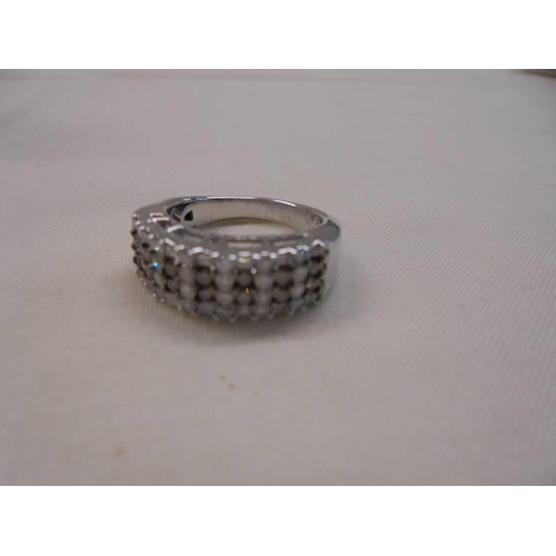 1061 - A champagne and white diamond band ring set with round and baguette diamonds in white metal stamped ... 