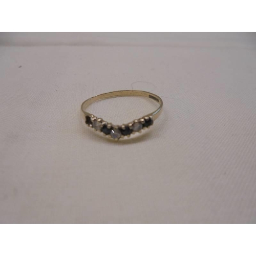 1064 - A diamond/sapphire cluster ring in 9ct gold and a wishbone ring in 9ct gold, sizes N half and O, 2.6... 