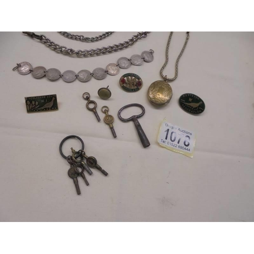 1078 - A mixed lot including watch chains, watch keys, coin bracelet etc.,