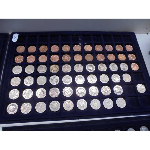 1083 - Four trays of decimal and pre-decimal coins.