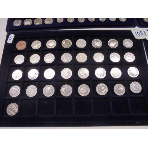 1083 - Four trays of decimal and pre-decimal coins.