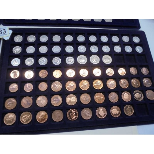 1083 - Four trays of decimal and pre-decimal coins.