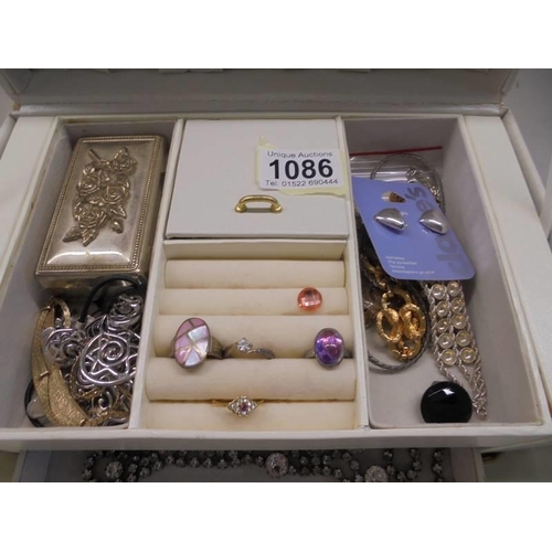 1086 - A vintage jewellery box and a mixed lot of costume jewellery.