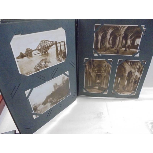 1088 - An old postcard album, and old photograph album and other albums.