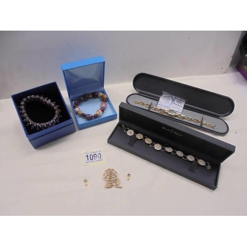 1090 - A Danbury mint bracelet, two other bracelets, a ladies wristwatch and a brooch.