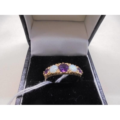 1094 - An 18ct gold ring set opals and amethysts, size P, 2.3 grams.