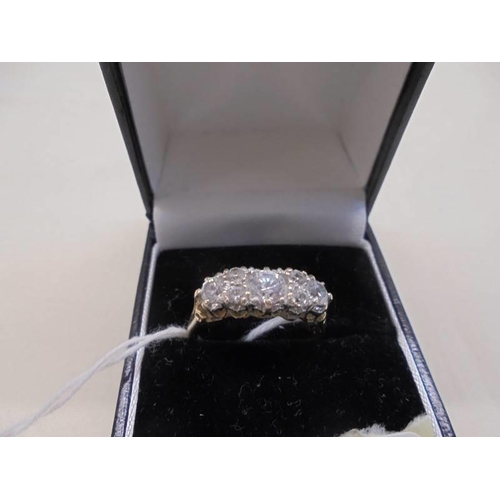 1096 - A 9ct gold ring set five white stones, size P, 2.6 grams.