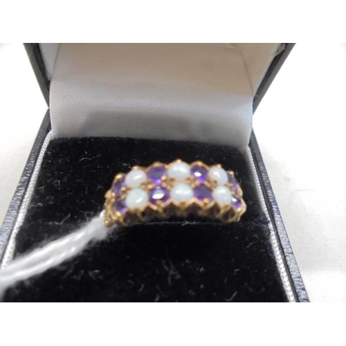 1098 - A gold ring set opals and amethysts, sizs P half, 2.6 grams.