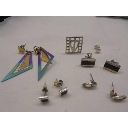 1100 - Three pairs of silver earrings, another pair of earrings and two single earrings.