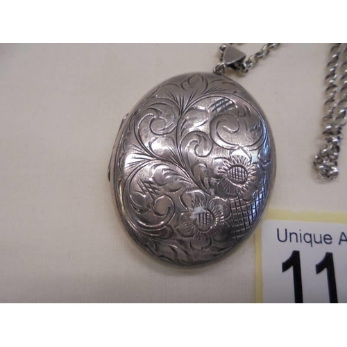 1109 - A vintage hall marked silver locket on chain.