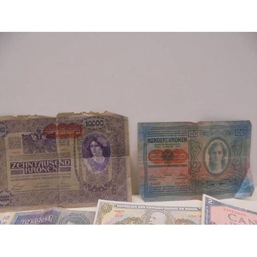 1122 - A Quantity of old bank notes including German and four old crowns.