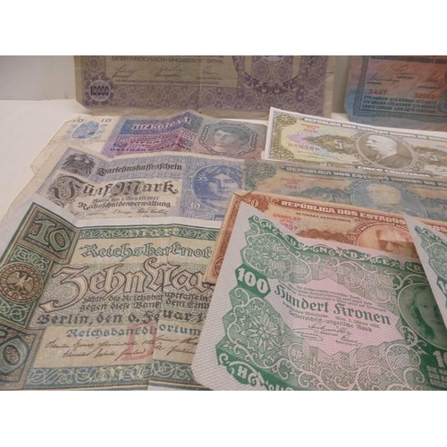 1122 - A Quantity of old bank notes including German and four old crowns.