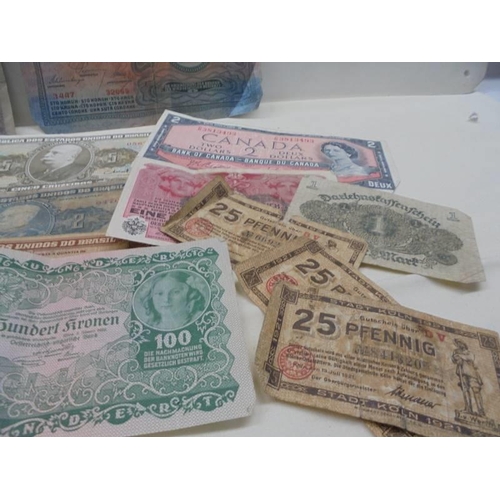 1122 - A Quantity of old bank notes including German and four old crowns.