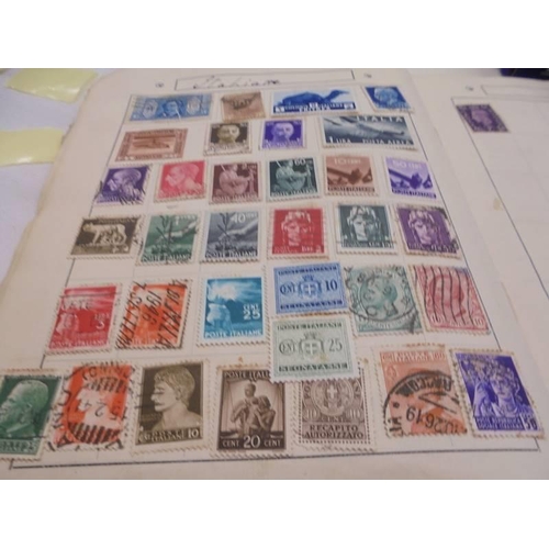 1142 - An album of stamps, loose stamps and an empty stamp album.