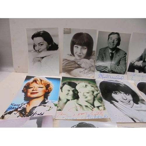 1145 - A quantity of photographs of mainly 'Carry on Stars' some with autographs.