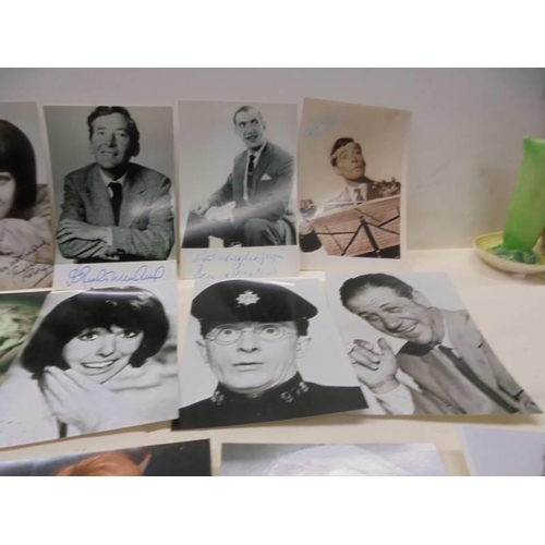 1145 - A quantity of photographs of mainly 'Carry on Stars' some with autographs.