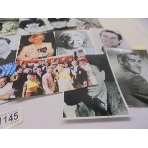 1145 - A quantity of photographs of mainly 'Carry on Stars' some with autographs.