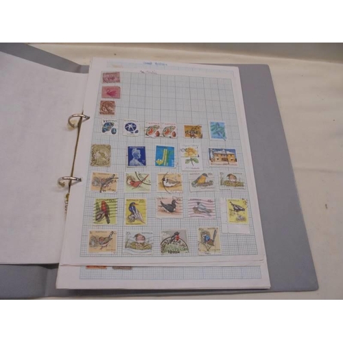 1147 - Three folders of UK and world stamps.