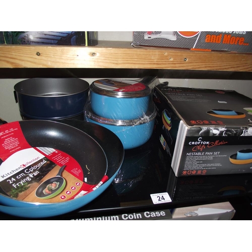 24 - A set of 2 new saucepans, frying pan, wok, 2 baing tins and a nestable pan set