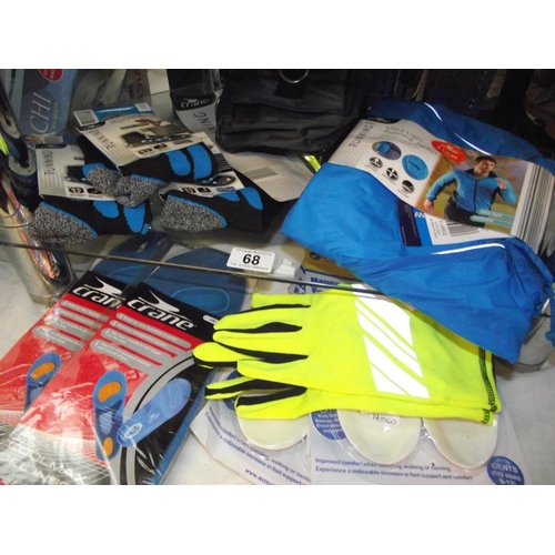 68 - A quantity of new running items including socks, gloves, ultra light running jacket size XL etc