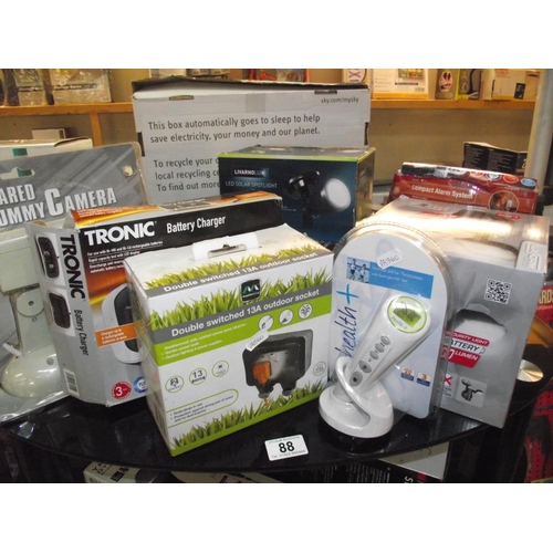 88 - A misc lot of new items including ear and forehead thermometer, alarm system, solar lights etc