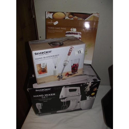 13 - A boxed Silvercrest handmixer set, a hand blender set and tiered cake pans