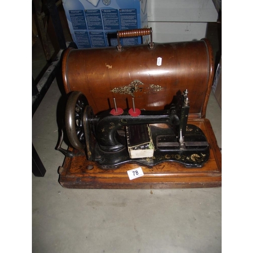 78 - A cased Singer sewing machine COLLECT ONLY