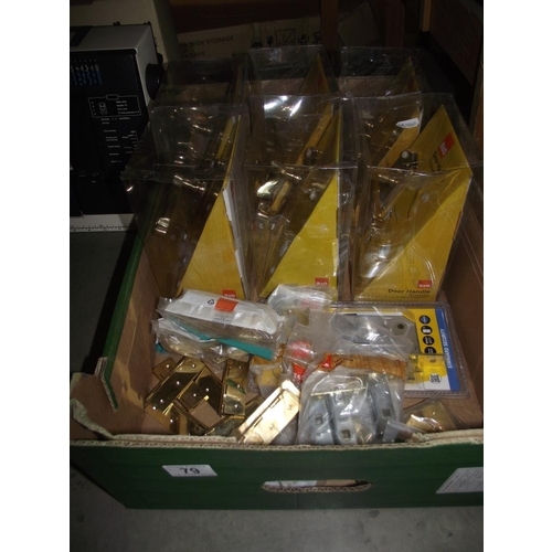 79 - A quantity of new door handles etc in packaging