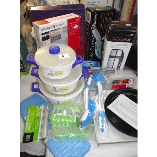 87 - A quantity of new kitchen items including vacuum flask etc